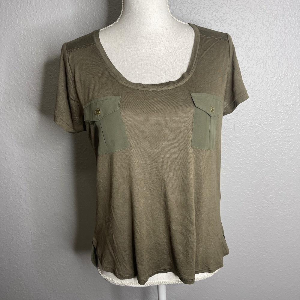 Green top with pocket detail sheer back top is see thru
